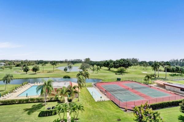 aerial view with a water view and golf course view