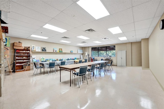 dining space with a paneled ceiling and visible vents