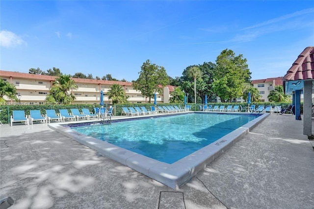 pool featuring a patio area and fence