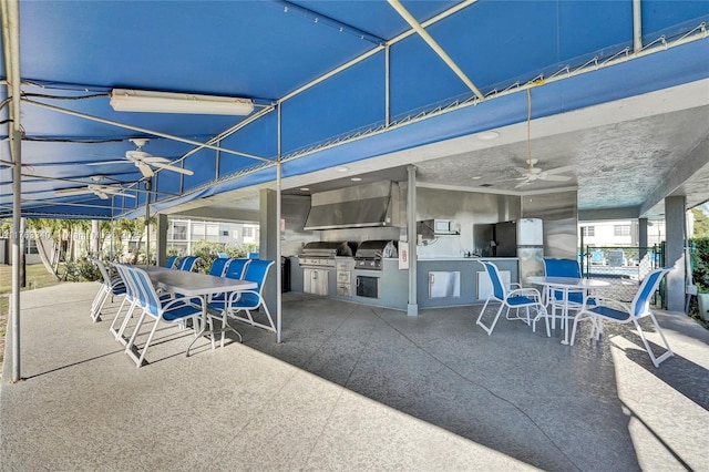 view of patio / terrace featuring a ceiling fan, outdoor dining space, area for grilling, and a grill