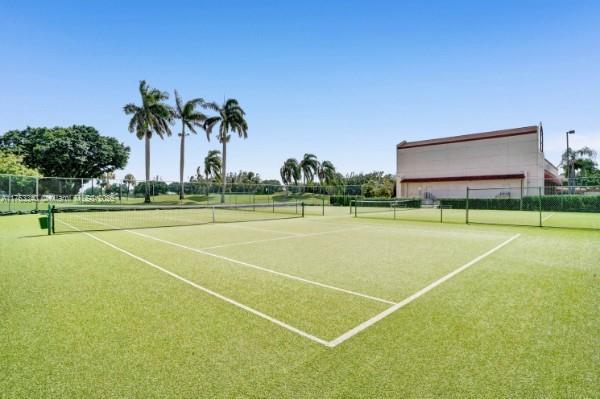 view of sport court with fence