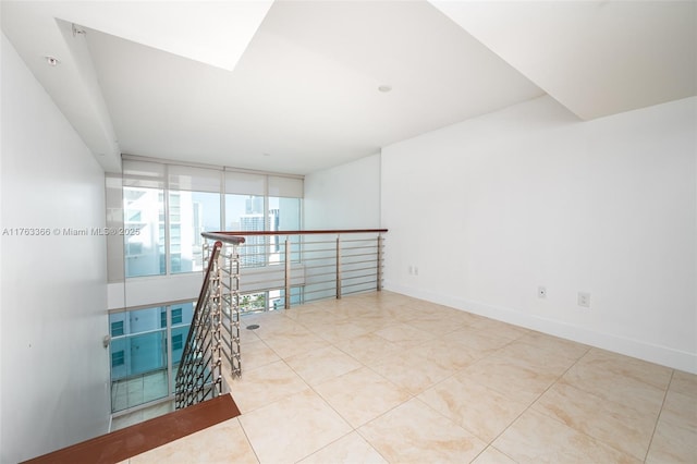 41 SE 5th St Unit 1815, Miami, FL 33131 - empty room with tile patterned flooring, expansive windows, and baseboards