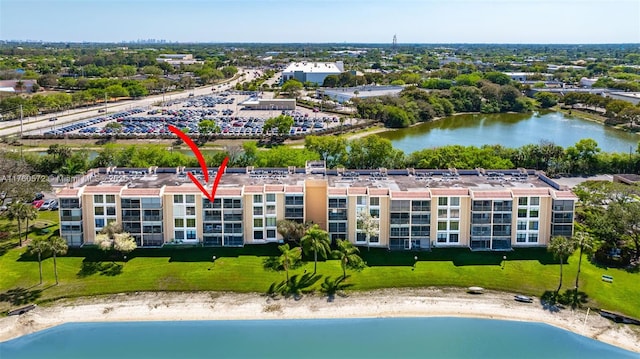 birds eye view of property with a water view