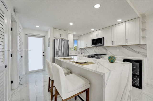 kitchen featuring beverage cooler, white cabinets, marble finish floor, stainless steel appliances, and open shelves