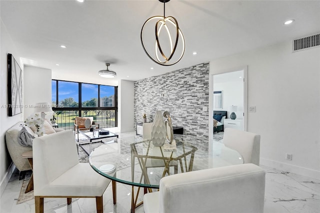 dining area featuring a wall of windows, recessed lighting, visible vents, and marble finish floor