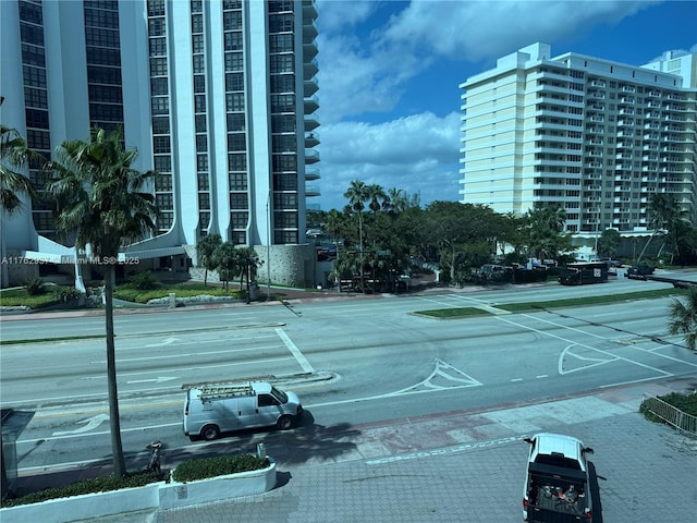 exterior space featuring curbs and sidewalks