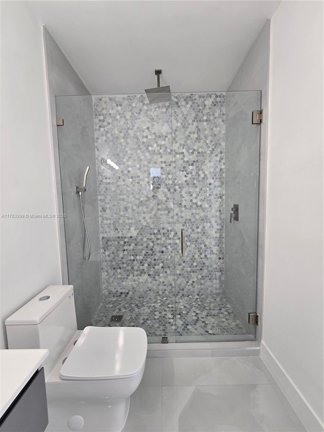 full bathroom with a stall shower, toilet, and vanity