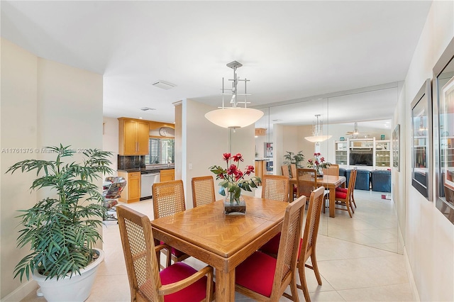 dining room with light tile patterned floors and visible vents