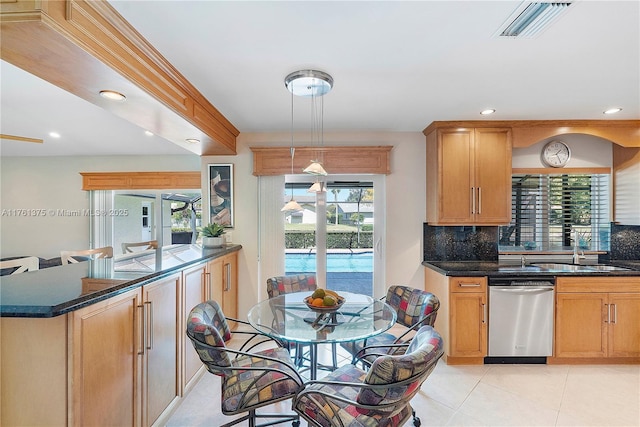 kitchen featuring visible vents, a sink, french doors, stainless steel dishwasher, and backsplash