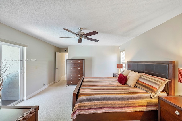 bedroom featuring access to exterior, baseboards, light carpet, a textured ceiling, and a ceiling fan