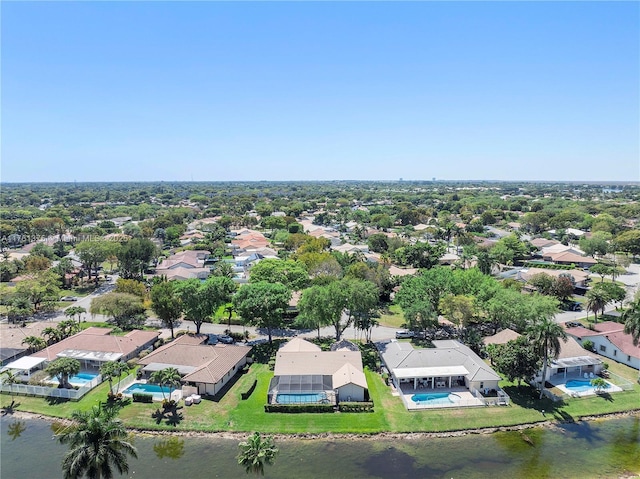 bird's eye view featuring a residential view and a water view