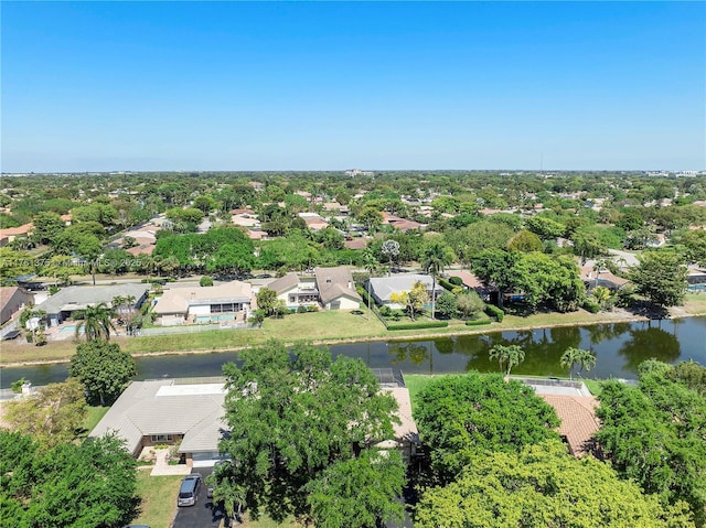 birds eye view of property featuring a water view and a residential view