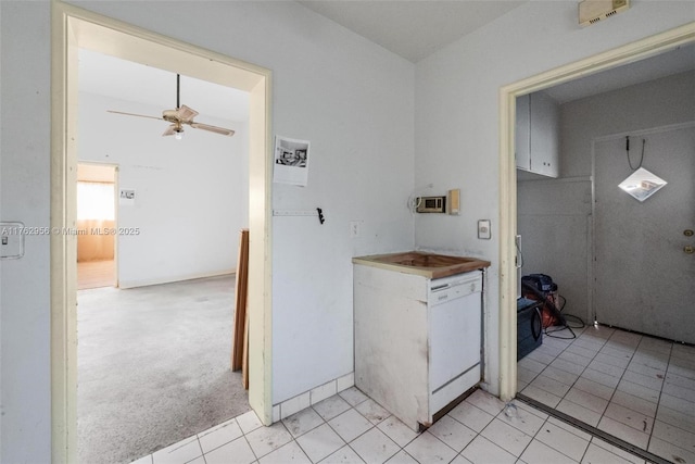 laundry room featuring light colored carpet and ceiling fan