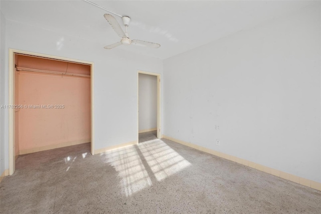 unfurnished bedroom featuring a ceiling fan and a closet