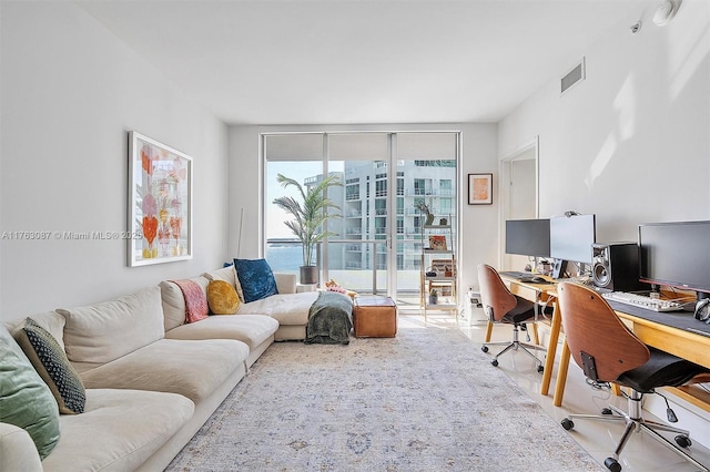 office space featuring visible vents and expansive windows