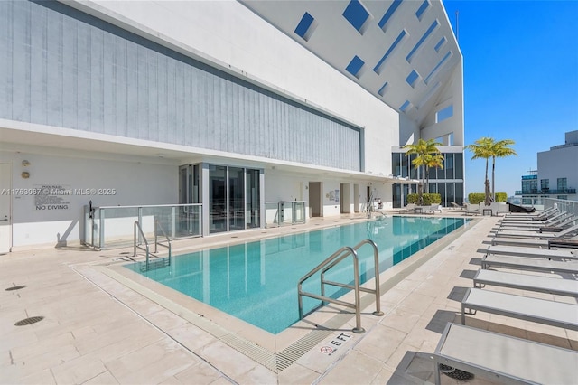 community pool featuring a patio area