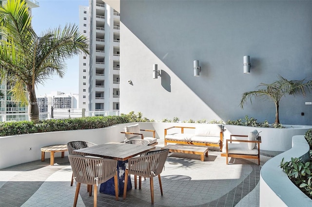 view of patio featuring outdoor dining space and an outdoor hangout area