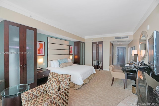 bedroom with visible vents, crown molding, baseboards, carpet, and french doors