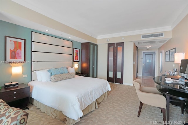 carpeted bedroom with visible vents and baseboards