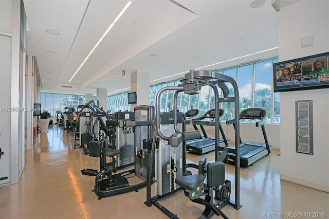 workout area featuring baseboards