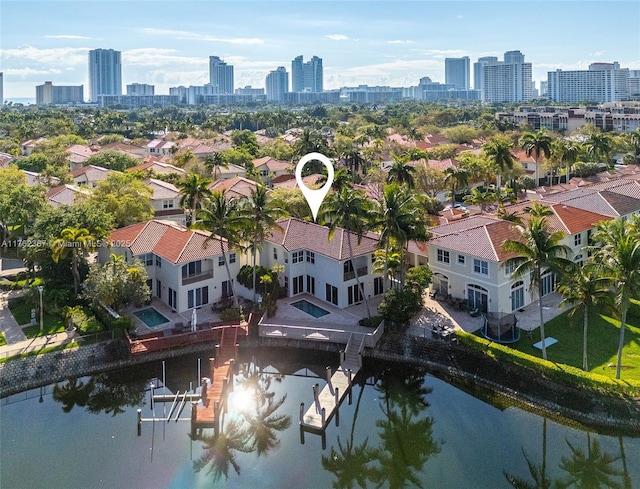 drone / aerial view with a water view and a view of city