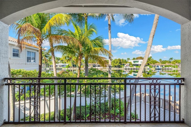 balcony featuring a water view