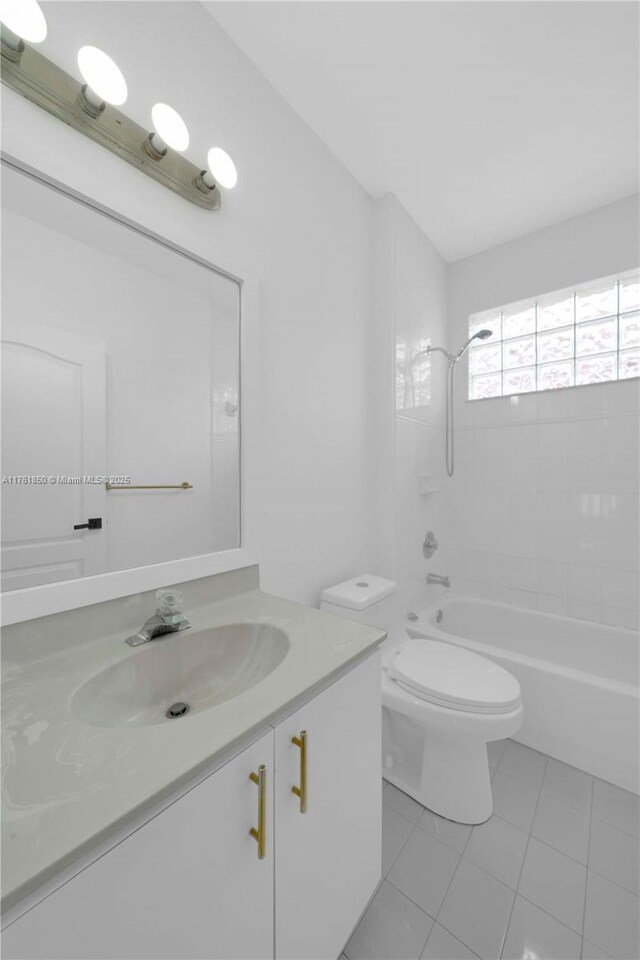 15712 SW 90th Ter, Miami, FL 33196 - full bathroom with tile patterned flooring, washtub / shower combination, vanity, and toilet