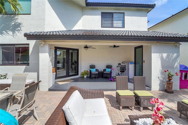 view of patio / terrace with french doors and ceiling fan