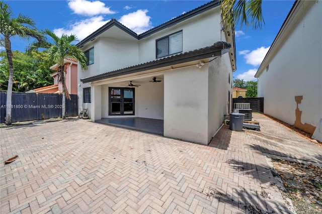 15712 SW 90th Ter, Miami, FL 33196 - rear view of property featuring stucco siding, a ceiling fan, fence, and a patio area