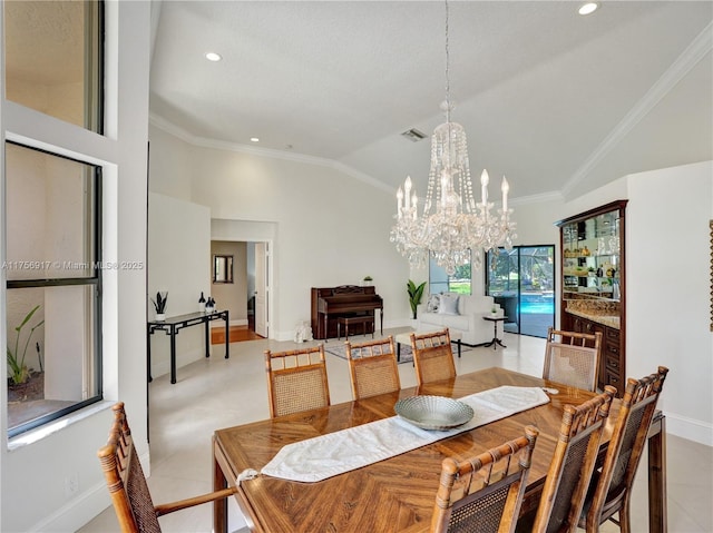 dining space featuring a notable chandelier, recessed lighting, and ornamental molding