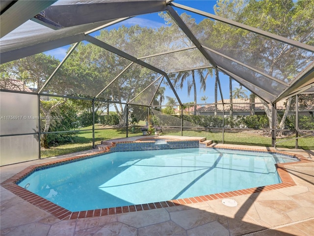 pool with an in ground hot tub and a lanai