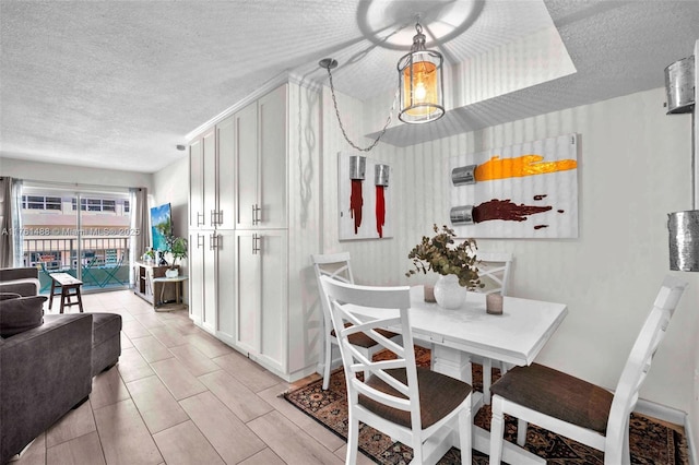 dining room with a textured ceiling