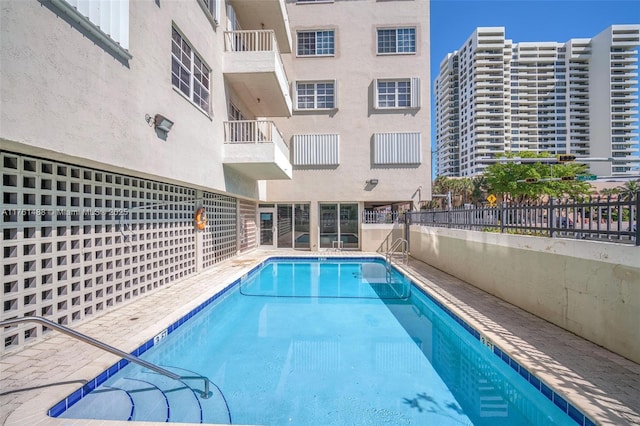 community pool with fence