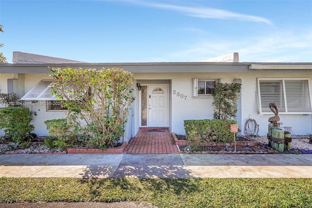 view of front of house featuring stucco siding