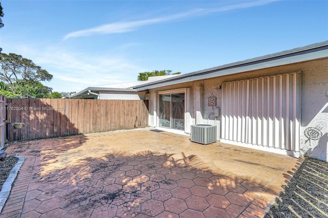 view of patio / terrace featuring cooling unit and fence