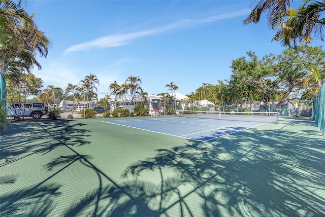 view of tennis court with fence