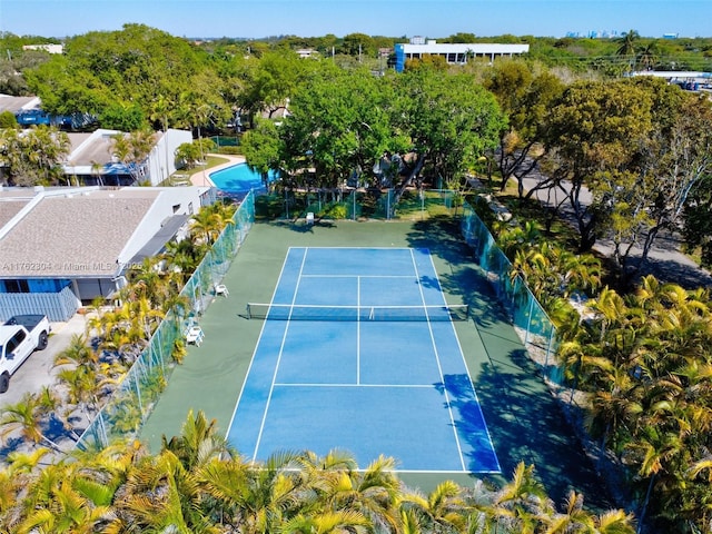 view of tennis court with fence