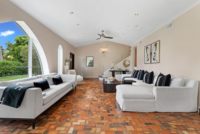 living area with a ceiling fan, visible vents, lofted ceiling, recessed lighting, and stairs