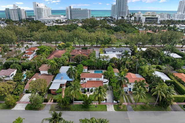 aerial view featuring a view of city and a water view