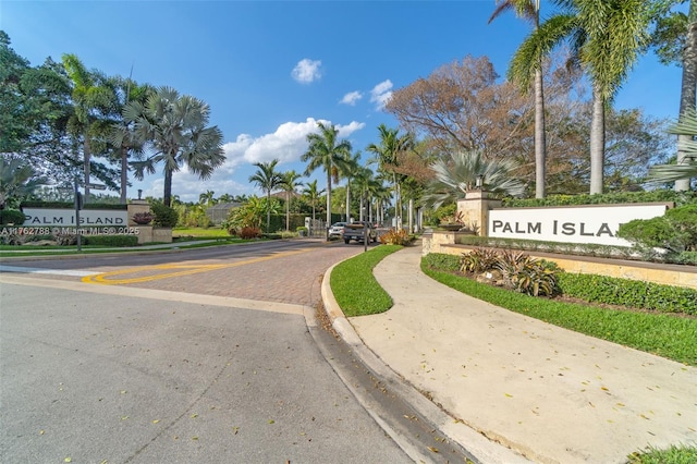 view of road with sidewalks and curbs