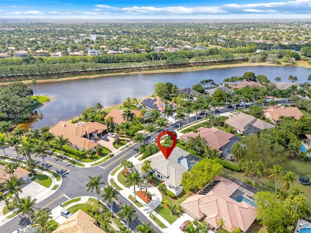 birds eye view of property featuring a residential view and a water view