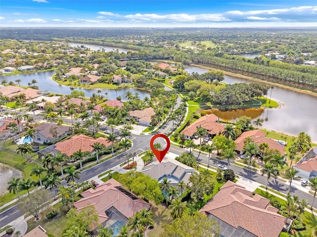 aerial view featuring a residential view and a water view