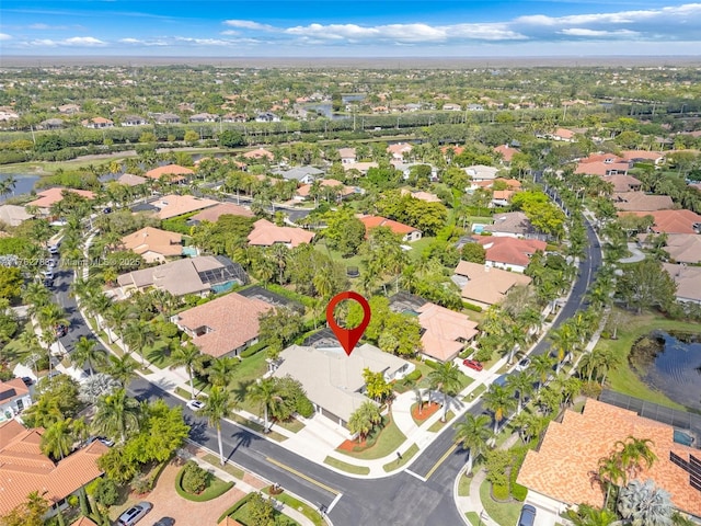 aerial view with a residential view and a water view