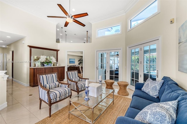 living room with crown molding, light tile patterned flooring, plenty of natural light, and ceiling fan