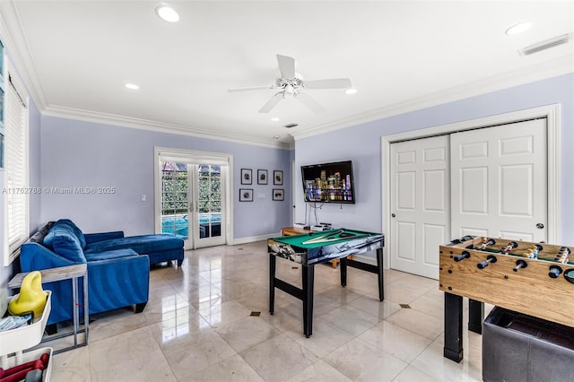 game room featuring french doors, a ceiling fan, visible vents, and crown molding