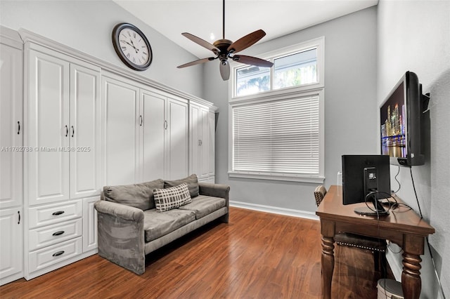 office area with ceiling fan, baseboards, wood finished floors, and vaulted ceiling