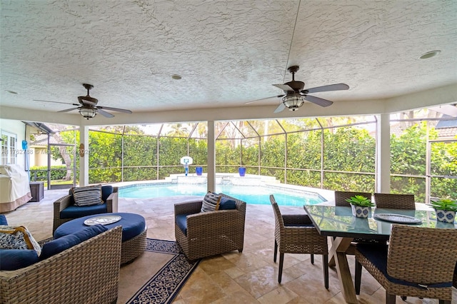 outdoor pool featuring area for grilling, a ceiling fan, an outdoor living space, a patio, and a lanai