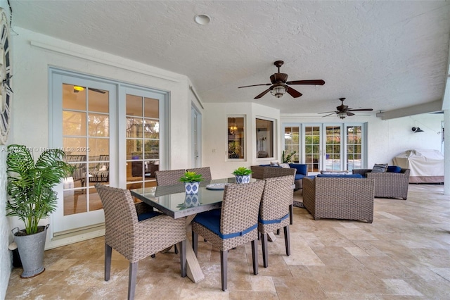 view of patio featuring outdoor dining space, outdoor lounge area, and a ceiling fan