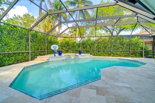 pool with a lanai and a patio