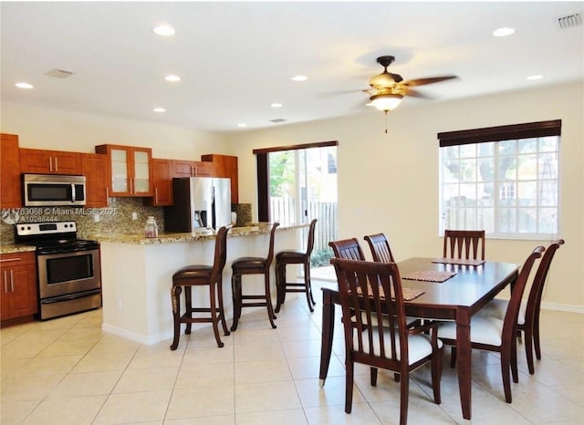 dining area featuring light tile patterned floors, visible vents, recessed lighting, and a ceiling fan